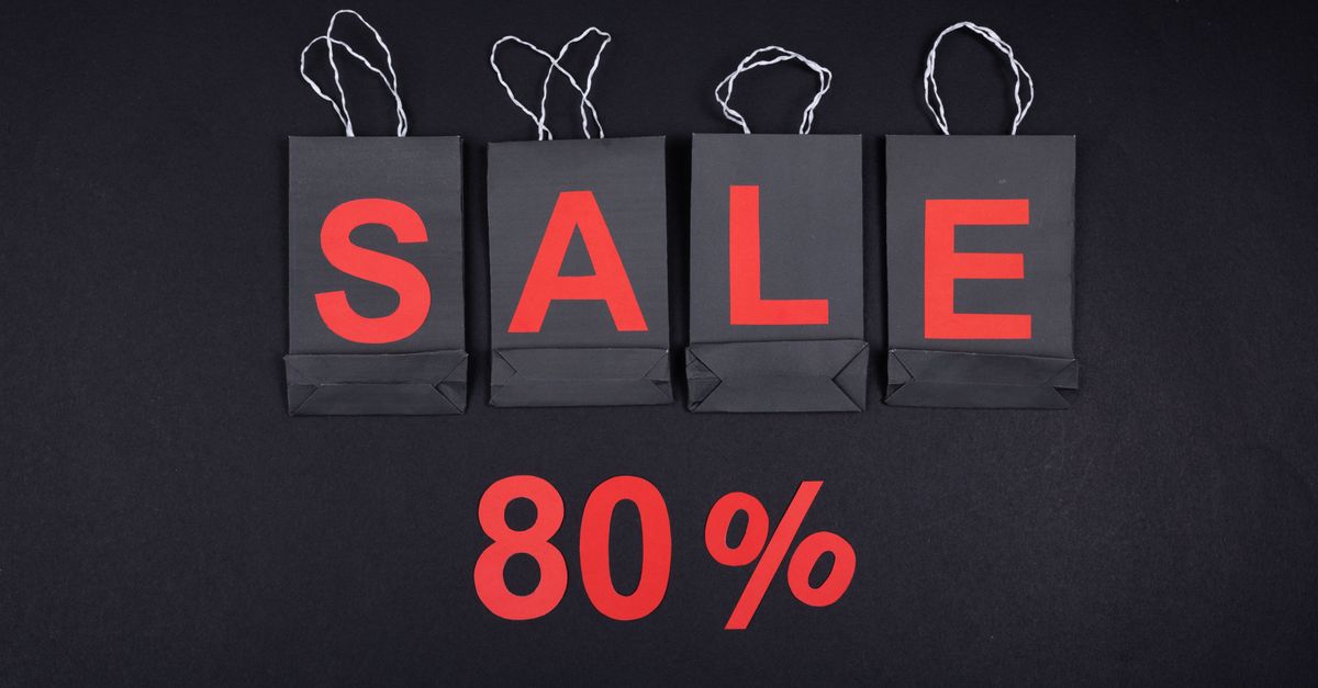 Highlighting a sale with 80% discount using black shopping bags and bold red text.